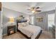 Bedroom featuring neutral walls, carpet, ceiling fan, and tasteful decor at 1547 Grove Arbor Ter, Dacula, GA 30519
