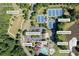 Aerial photo showcases community amenities: a pool, tennis/basketball/volleyball courts, playground, and clubhouse at 1547 Grove Arbor Ter, Dacula, GA 30519
