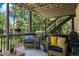 Spacious deck with comfortable seating and stairs to the backyard at 1547 Grove Arbor Ter, Dacula, GA 30519