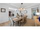 Bright dining area featuring stylish light fixture and neutral decor at 1547 Grove Arbor Ter, Dacula, GA 30519