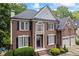 Beautiful brick home with a manicured lawn and two-car garage at 1547 Grove Arbor Ter, Dacula, GA 30519