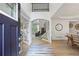 Inviting foyer with hardwood floors, staircase and a view into the dining room at 1547 Grove Arbor Ter, Dacula, GA 30519