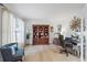 Bright and well-organized office space with built-in shelving and a comfortable chair at 1547 Grove Arbor Ter, Dacula, GA 30519