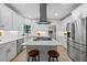 Modern kitchen with stainless steel appliances, center island, and white cabinets at 1547 Grove Arbor Ter, Dacula, GA 30519