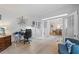 Comfortable home office with French doors, hardwood flooring, and an adjacent dining room at 1547 Grove Arbor Ter, Dacula, GA 30519