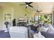 Comfortable screened porch with ceiling fans, stylish seating, and peaceful views of the outdoors at 1547 Grove Arbor Ter, Dacula, GA 30519