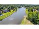 Scenic water view surrounded by lush greenery and beautiful homes in a desirable neighborhood at 1547 Grove Arbor Ter, Dacula, GA 30519
