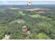 Overhead view of property with pool, home and expansive tree-covered land at 280 W Knight W Rd, Mcdonough, GA 30252