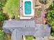 Aerial view of home with a swimming pool, well-maintained roof, manicured lawn, and beautiful surrounding landscape at 280 W Knight W Rd, Mcdonough, GA 30252