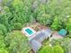 Stunning aerial view of a property surrounded by lush greenery, featuring a pool, expansive backyard, and serene setting at 280 W Knight W Rd, Mcdonough, GA 30252