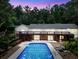 A refreshing swimming pool with an elevated deck, perfect for relaxing and entertaining in the backyard at 280 W Knight W Rd, Mcdonough, GA 30252