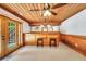 Home bar features wood accents, mirrored backdrop, overhead lighting, and easy access to the outdoor area with comfortable seating at 280 W Knight W Rd, Mcdonough, GA 30252