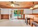 Home bar with wood accents, seating, and easy access to the backyard pool, creating a perfect entertainment space at 280 W Knight W Rd, Mcdonough, GA 30252