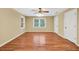 Bedroom featuring hardwood floors, a ceiling fan, and multiple closets at 280 W Knight W Rd, Mcdonough, GA 30252