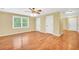 Bedroom featuring hardwood floors, a ceiling fan, and multiple closets at 280 W Knight W Rd, Mcdonough, GA 30252