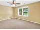 Bedroom featuring neutral paint, a ceiling fan, and a window providing natural light at 280 W Knight W Rd, Mcdonough, GA 30252