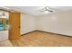Bedroom features wood floors, a ceiling fan, and French doors leading to the backyard at 280 W Knight W Rd, Mcdonough, GA 30252