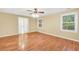 Bright bedroom with hardwood floors and French doors leading outside at 280 W Knight W Rd, Mcdonough, GA 30252