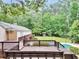 Spacious deck overlooking the backyard and pool, perfect for outdoor entertaining and relaxation in a serene setting at 280 W Knight W Rd, Mcdonough, GA 30252