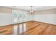 Bright living room with beautiful hardwood floors, wainscoting, and French doors at 280 W Knight W Rd, Mcdonough, GA 30252