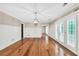 Bright living room with beautiful hardwood floors, wainscoting, and French doors to the exterior at 280 W Knight W Rd, Mcdonough, GA 30252