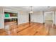 Open concept living room with hardwood floors adjacent to the kitchen at 280 W Knight W Rd, Mcdonough, GA 30252
