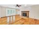 Spacious living room with a fireplace and French doors leading to the backyard at 280 W Knight W Rd, Mcdonough, GA 30252