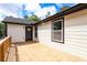 Charming back deck is ideal for relaxing or entertaining on the side of this newly renovated home at 932 Brian Ln, Forest Park, GA 30297
