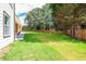 Expansive backyard features a well-maintained lawn and wooden privacy fence, offering ample space for outdoor activities at 932 Brian Ln, Forest Park, GA 30297