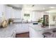 Modern kitchen featuring granite countertops, stainless steel appliances, and ample cabinetry at 932 Brian Ln, Forest Park, GA 30297