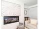 Stylish living room featuring modern decor, a sleek fireplace, and neutral tones at 932 Brian Ln, Forest Park, GA 30297