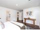 Bright main bedroom shows hardwood floors, access to the bathroom and hall, and a decorative table at 932 Brian Ln, Forest Park, GA 30297