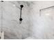 Elegant shower with marble tile, rainfall showerhead, and niche at 932 Brian Ln, Forest Park, GA 30297
