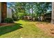 Exterior shot showcasing the spacious backyard with green grass and landscaping at 2471 Cedar W Brk, Marietta, GA 30067