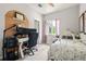Comfortable bedroom featuring a bed, a desk, and a window with natural light at 2471 Cedar W Brk, Marietta, GA 30067