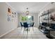Bright dining area featuring tile floors, a modern light fixture, and a large window for ample natural light at 2471 Cedar W Brk, Marietta, GA 30067