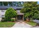 Charming townhome with mature trees, neutral siding, and driveway, offering a welcoming curb appeal at 2471 Cedar W Brk, Marietta, GA 30067