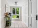 Hallway with a window, storage, and table adding character and functionality to the home's interior at 2471 Cedar W Brk, Marietta, GA 30067