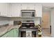 Stylish kitchen with granite countertops, white cabinets, and stainless steel appliances for a modern touch at 2471 Cedar W Brk, Marietta, GA 30067