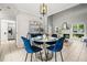 Open living space with a dining area, fireplace, and large window, perfect for entertaining and relaxation at 2471 Cedar W Brk, Marietta, GA 30067