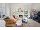 Bright living room with large windows, white fireplace, comfortable seating, and stylish decor at 2471 Cedar W Brk, Marietta, GA 30067