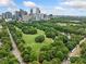 Expansive aerial view of a green park area with trees, baseball field, and city skyline backdrop at 411 10Th Ne St # 6, Atlanta, GA 30309