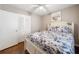 Cozy bedroom with hardwood floors, ceiling fan, and a large closet, showcasing a comfortable and inviting space at 411 10Th Ne St # 6, Atlanta, GA 30309