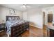 Bedroom featuring hardwood floors, a ceiling fan, a closet and access to an en suite bathroom at 411 10Th Ne St # 6, Atlanta, GA 30309