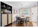 Cozy dining area with dark wood table and chairs, black display cabinet and modern decor at 411 10Th Ne St # 6, Atlanta, GA 30309