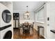 Dining area with seating for four, decorative light fixture, and built-in shelving, featuring wooden floors at 411 10Th Ne St # 6, Atlanta, GA 30309