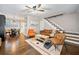 Hardwood floors, stairs, modern furnishings and open concept living and dining at 411 10Th Ne St # 6, Atlanta, GA 30309