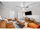 Cozy living room features hardwood floors, modern furnishings, ceiling fan and a large flatscreen television at 411 10Th Ne St # 6, Atlanta, GA 30309