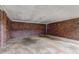 Basement space featuring exposed brick walls and a concrete floor at 5739 Cobb Mdw, Norcross, GA 30093