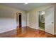 Bedroom with hardwood floors and two closets with ensuite bathrooms at 5739 Cobb Mdw, Norcross, GA 30093